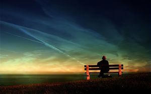 Sunset sitting on a row of chairs on the old man with sea background pictures