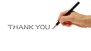 Main tenant un crayon pour écrire une image de remerciement PPT