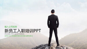 PPT template for induction training of new employees with white-collar background standing at the top of mountains