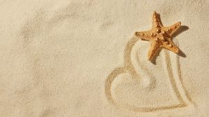 Beach sand on the love starfish slide background picture